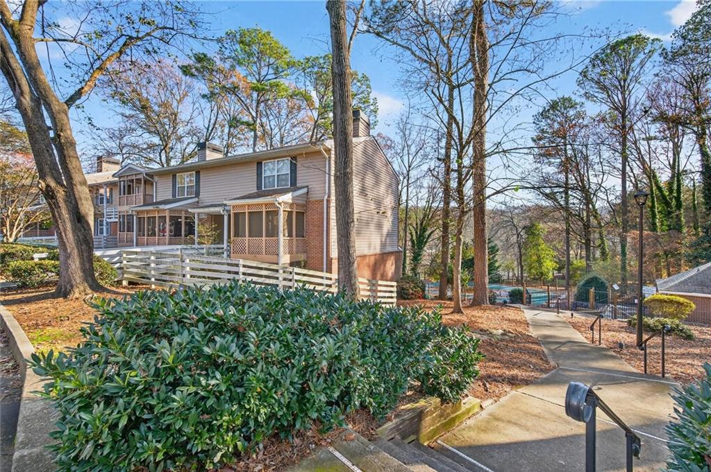 263 Quail Run Roswell, GA 30076 - Photo 34 of 47 a backyard of a house with lots of green space