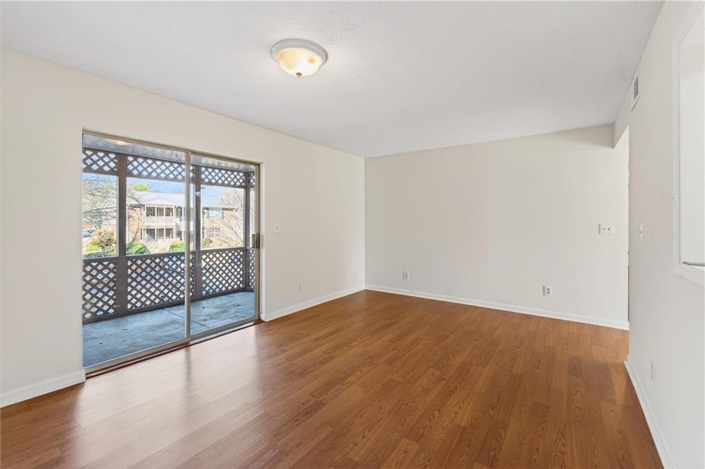 263 Quail Run Roswell, GA 30076 - Photo 9 of 47 wooden floor and glass door in a room