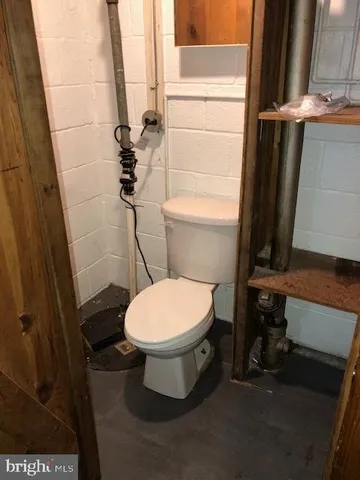 a bathroom with a toilet and a sink
