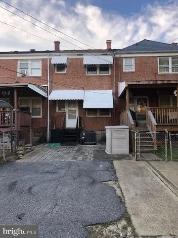 a front view of a house with glass windows