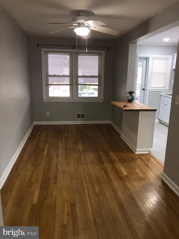 a view of workspace with wooden floor