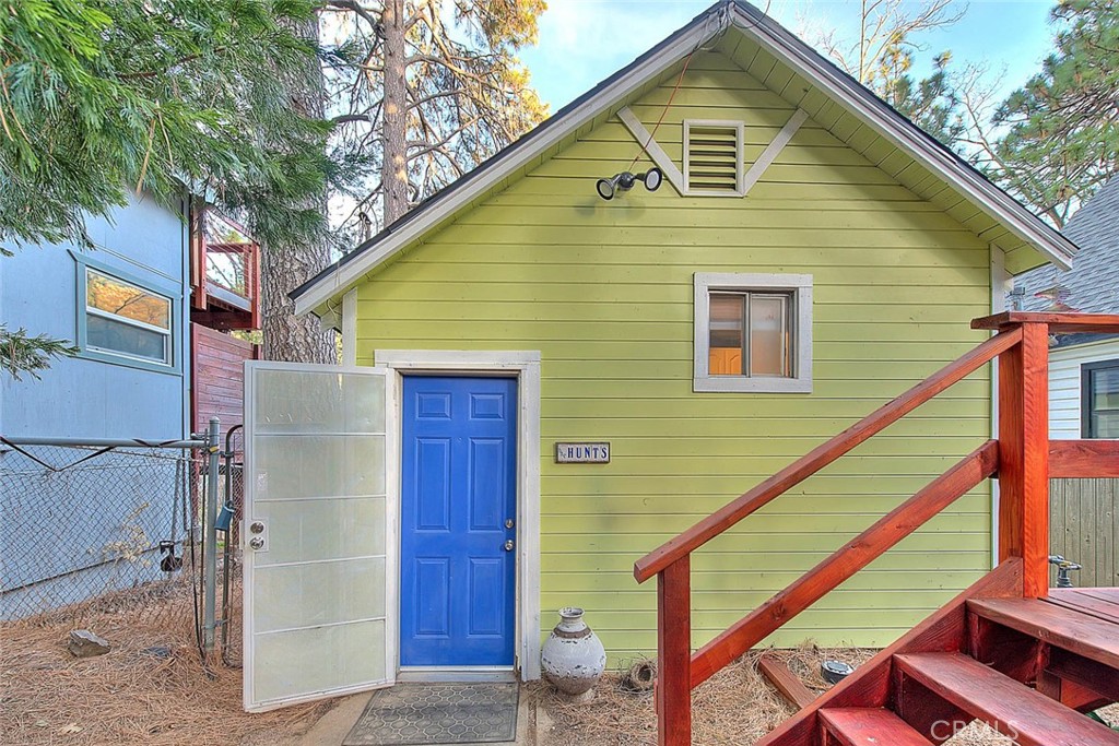 a view of a house with a small yard