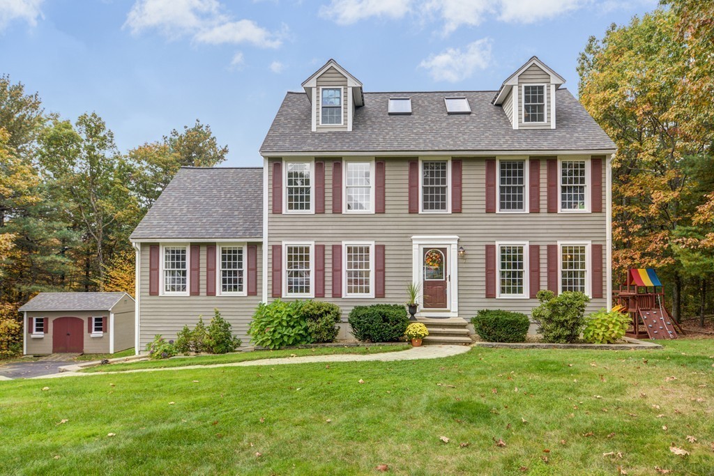 a front view of a house with a yard