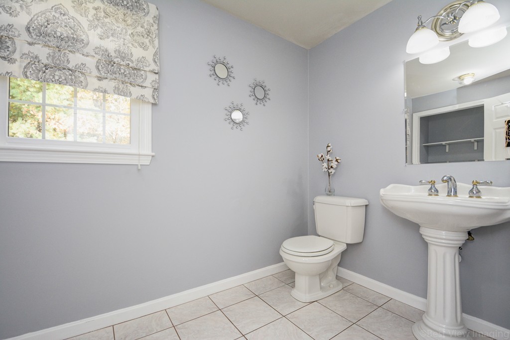7 Magnolia Drive Ayer, MA 01432 - Photo 11 of 28 a bathroom with a sink toilet and a mirror
