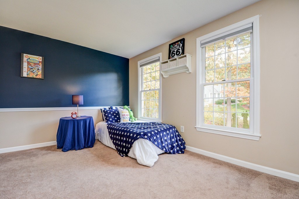 7 Magnolia Drive Ayer, MA 01432 - Photo 14 of 28 a room with a bed and a couch