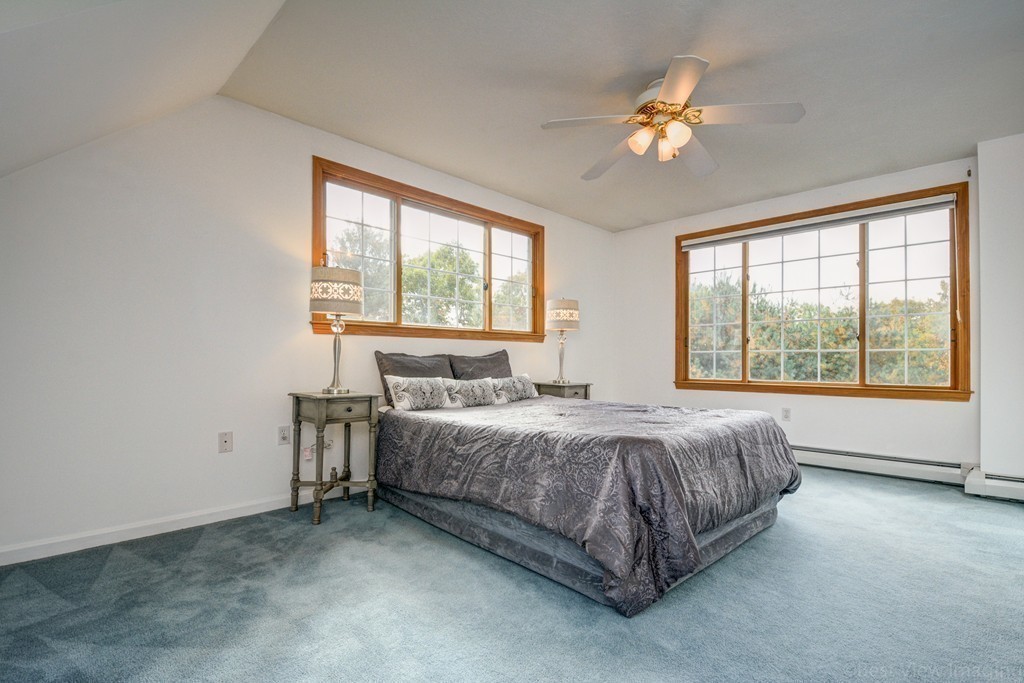 7 Magnolia Drive Ayer, MA 01432 - Photo 18 of 28 a spacious bedroom with a bed and a large window