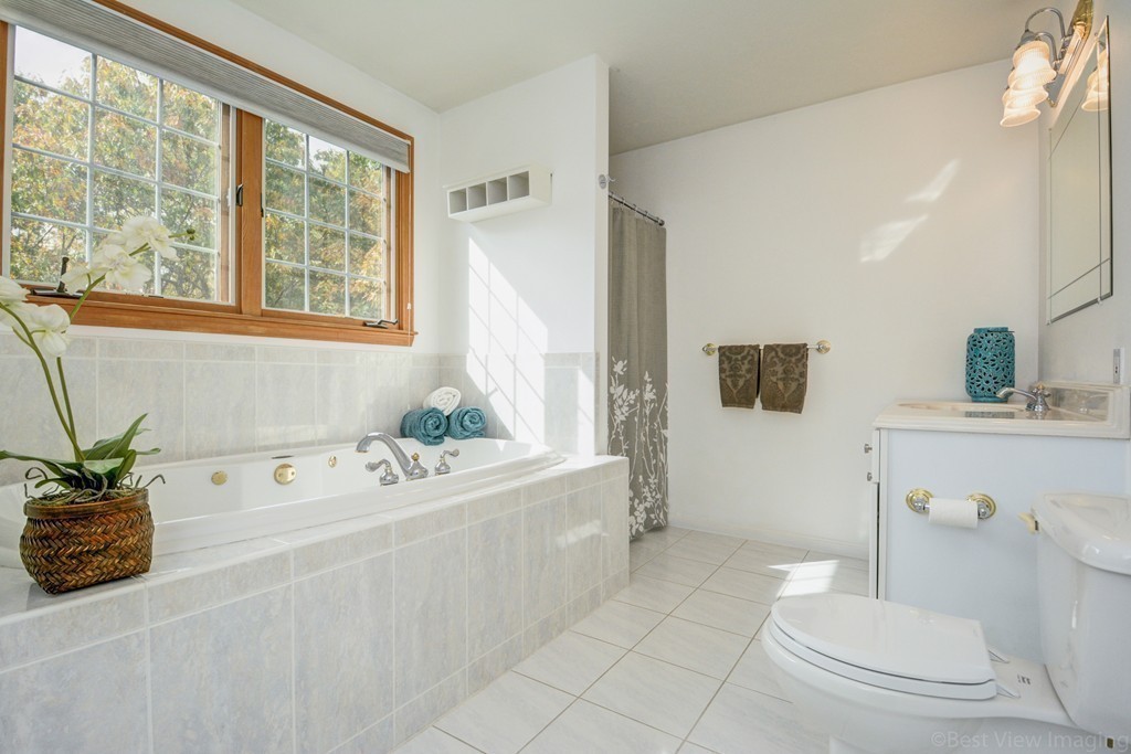 7 Magnolia Drive Ayer, MA 01432 - Photo 20 of 28 a bath room with a sink and a toilet