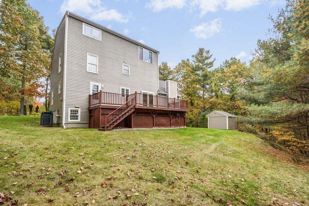 7 Magnolia Drive Ayer, MA 01432 - Photo 23 of 28 a view of a house with a yard