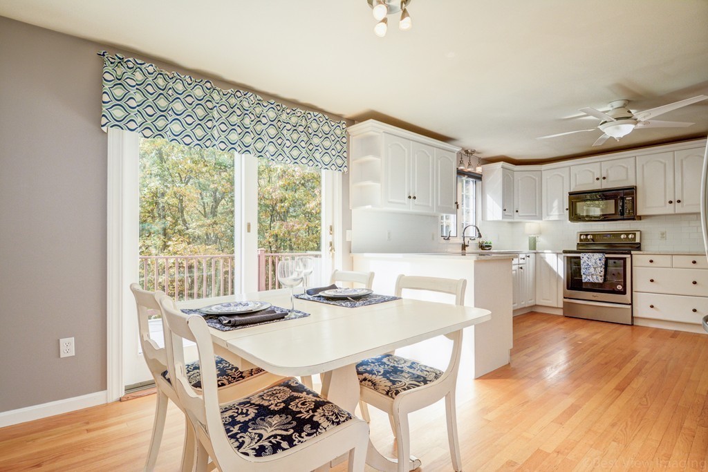 7 Magnolia Drive Ayer, MA 01432 - Photo 5 of 28 a view of a dining room with furniture window and wooden floor
