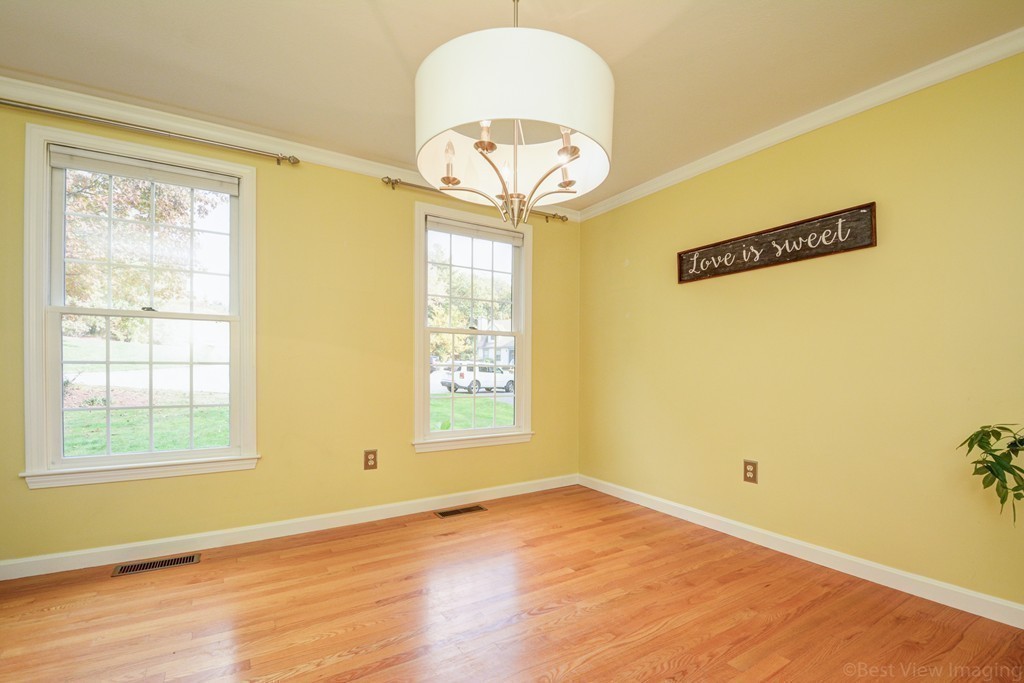 7 Magnolia Drive Ayer, MA 01432 - Photo 8 of 28 a view of a room with wooden floor and a window