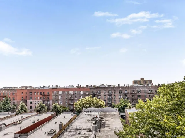 a view of a city with tall buildings