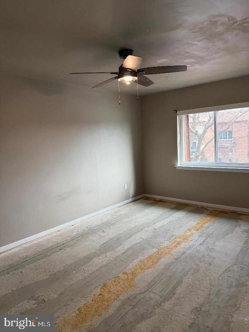 67203 Delaire Landing Road, Unit 203 Philadelphia, PA 19114 - Photo 11 of 29 an empty room with windows and ceiling fan
