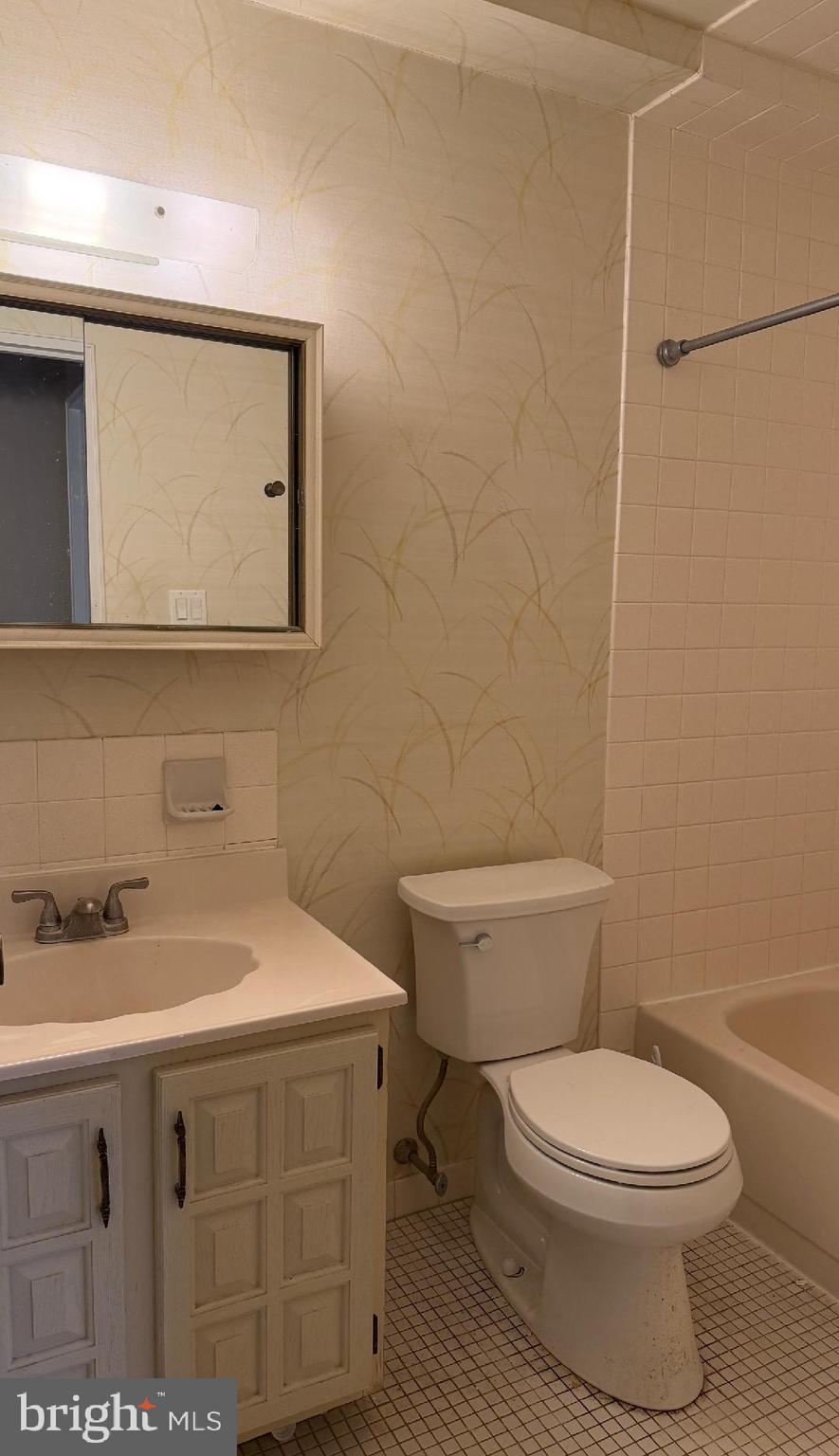 67203 Delaire Landing Road, Unit 203 Philadelphia, PA 19114 - Photo 14 of 29 a bathroom with a sink a toilet and mirror