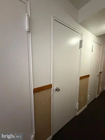 a view of a room with racks on the wall