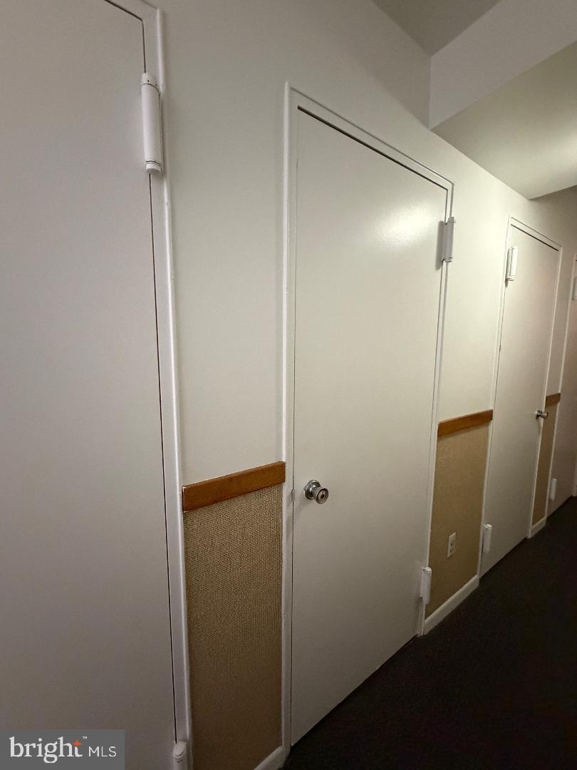 67203 Delaire Landing Road, Unit 203 Philadelphia, PA 19114 - Photo 17 of 29 a bathroom with a glass shower door