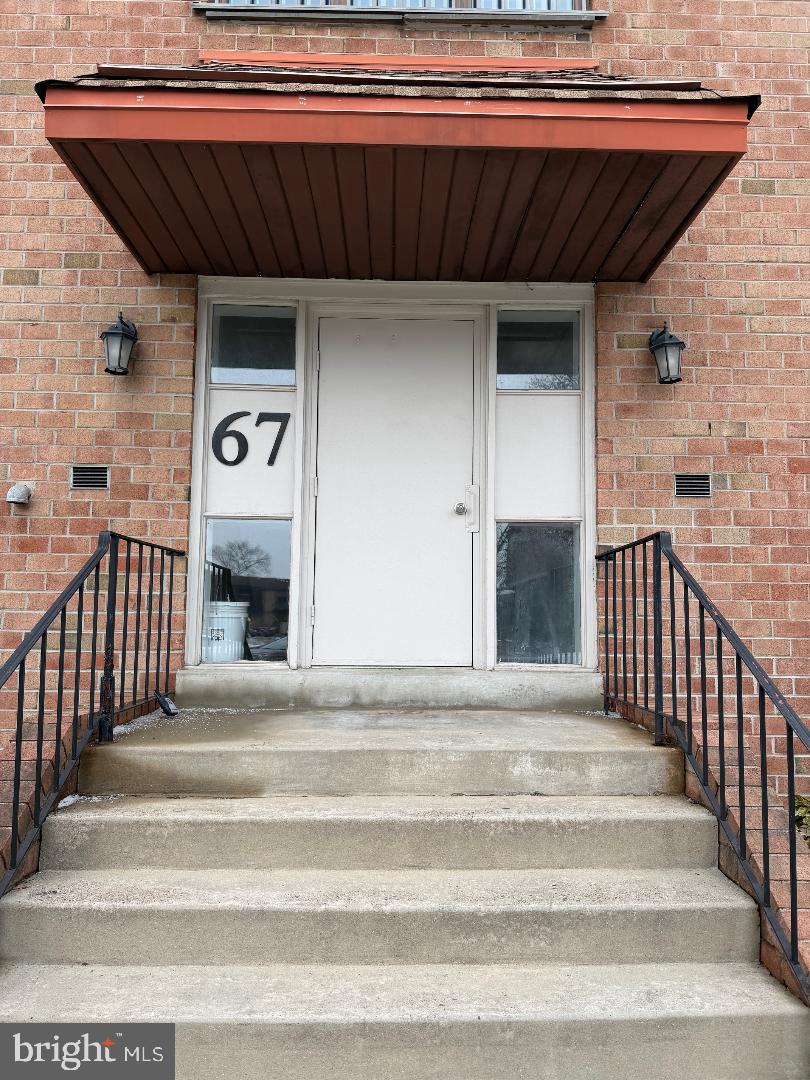 67203 Delaire Landing Road, Unit 203 Philadelphia, PA 19114 - Photo 19 of 29 a view of a fireplace and stairs