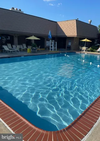 a view of yard with swimming pool