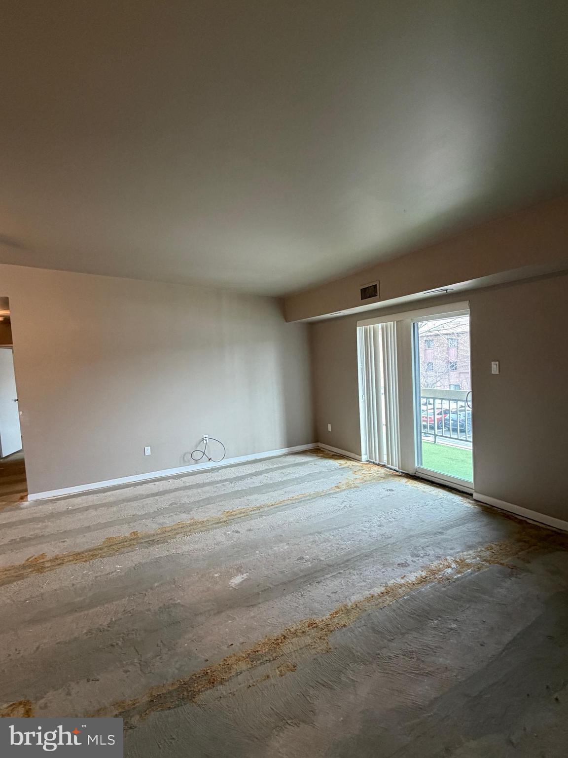 67203 Delaire Landing Road, Unit 203 Philadelphia, PA 19114 - Photo 5 of 29 a view of an empty room with wooden floor and a window
