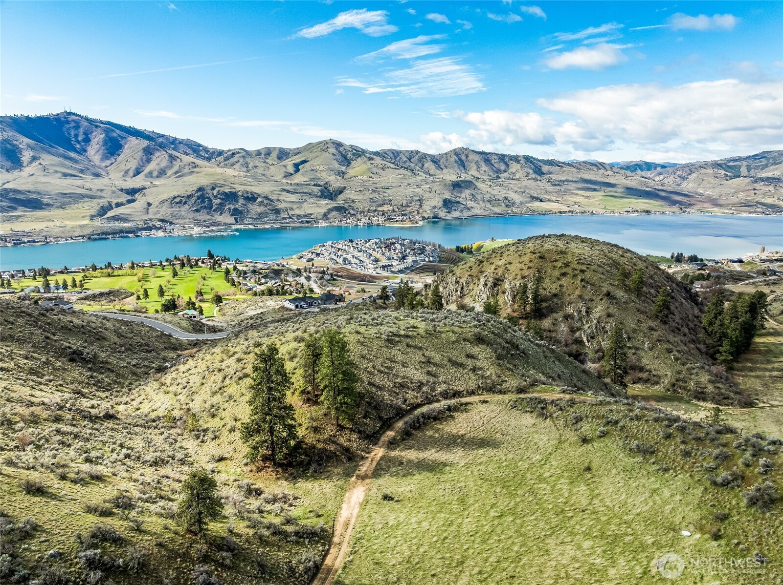 0 Skyfall Lane, Unit D Chelan, WA 98816 - Photo 1 of 31 a view of lake with mountain