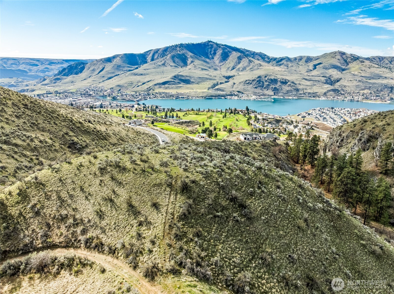 0 Skyfall Lane, Unit D Chelan, WA 98816 - Photo 13 of 31 a view of a lake with a mountain