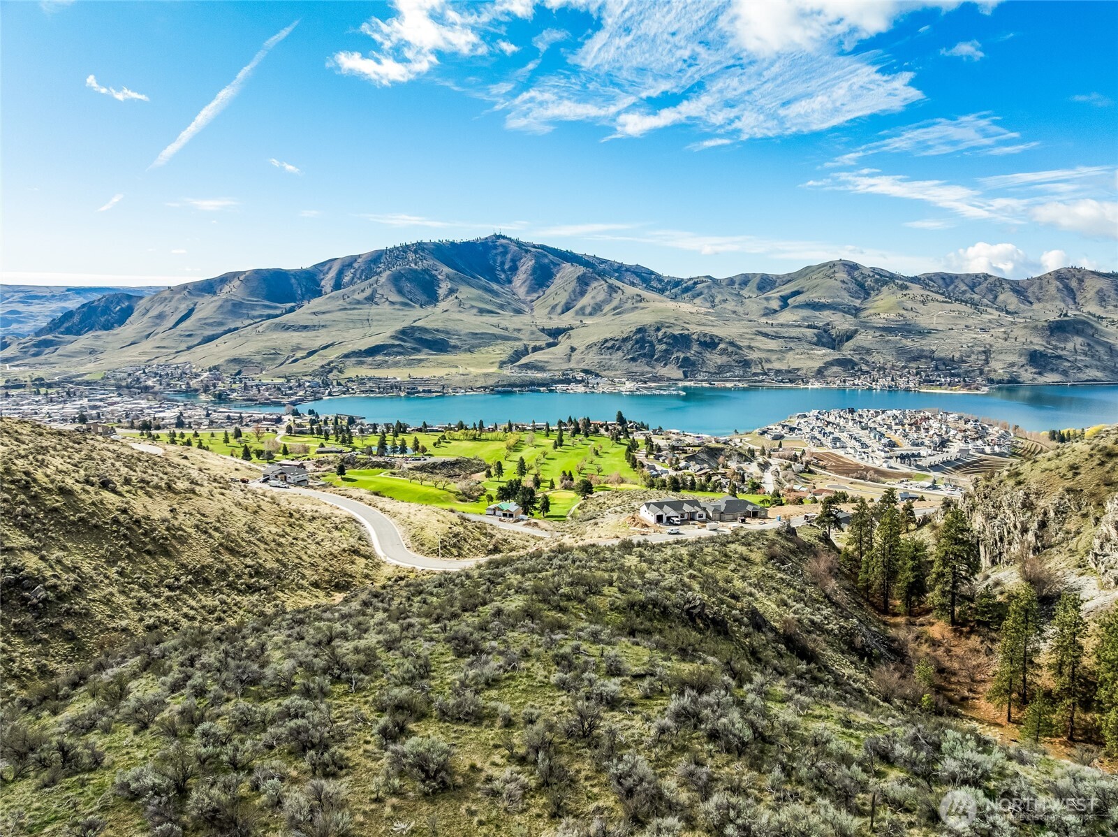 0 Skyfall Lane, Unit D Chelan, WA 98816 - Photo 14 of 31 a view of a lake with a mountain in the background