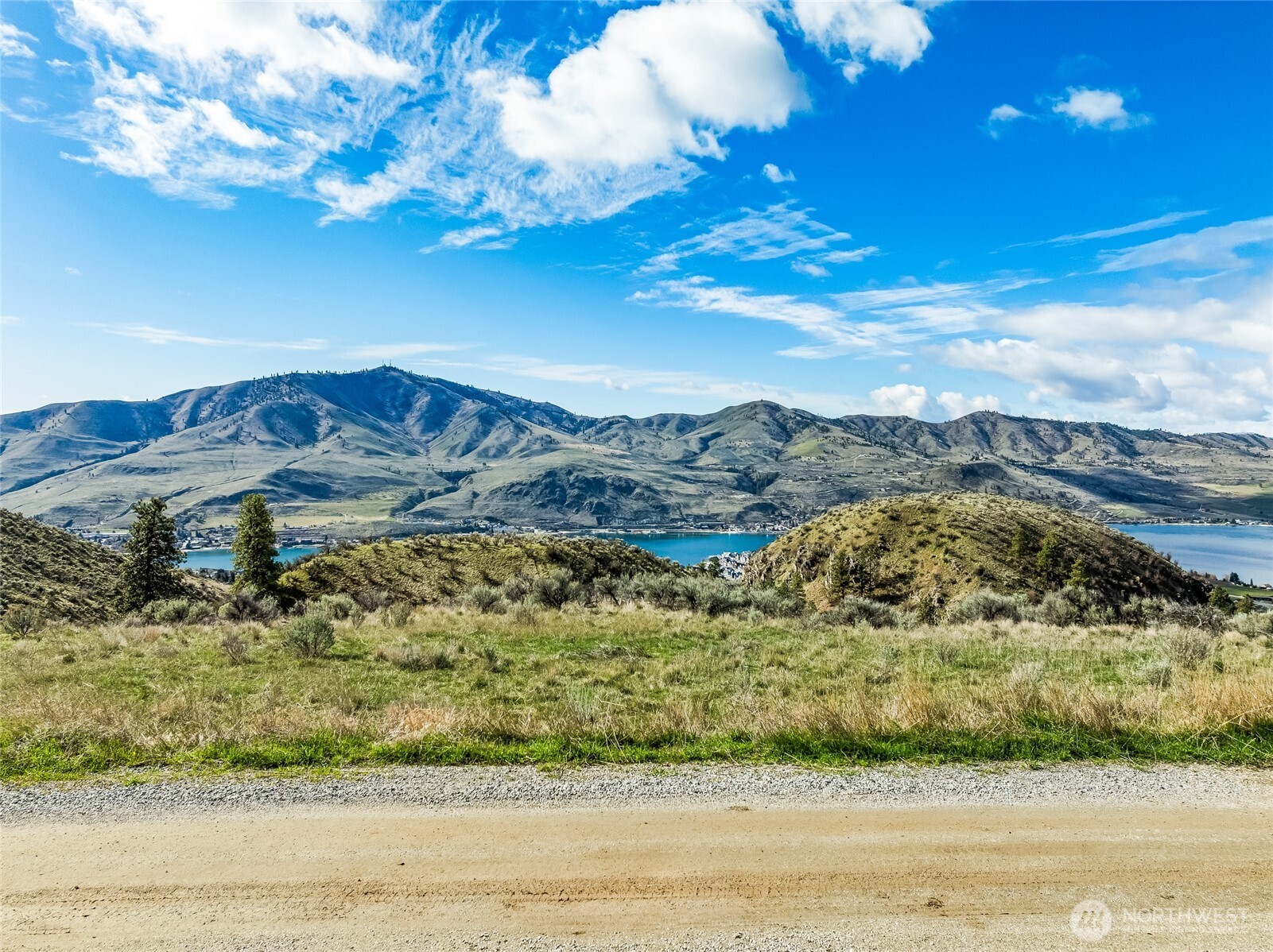 0 Skyfall Lane, Unit D Chelan, WA 98816 - Photo 18 of 31 a view of a lake with a mountain