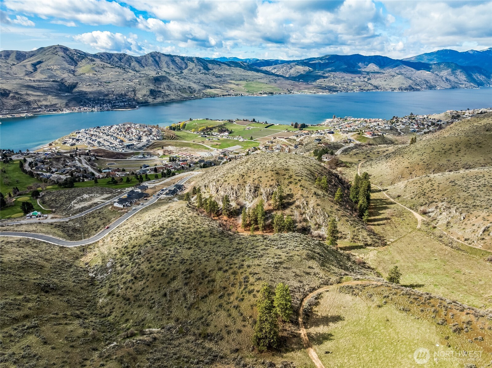 0 Skyfall Lane, Unit D Chelan, WA 98816 - Photo 25 of 31 a view of a lake with a mountain
