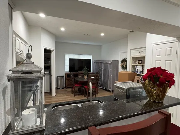 a view of a livingroom with furniture and a flat screen tv