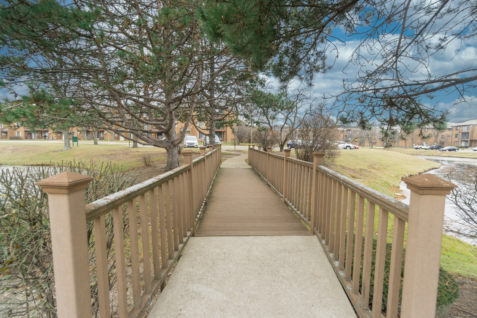 641 Briar Hill Lane, Unit 2 Addison, IL 60101 - Photo 15 of 16 a view of a balcony with wooden floor and fence