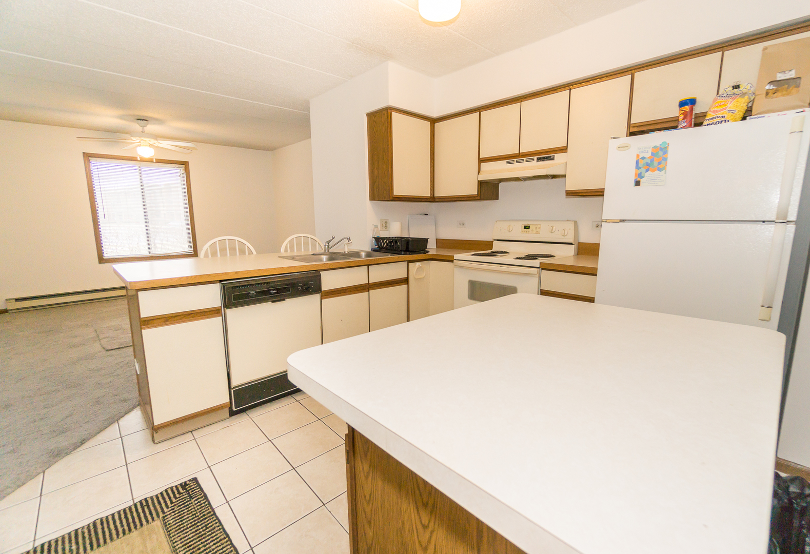 641 Briar Hill Lane, Unit 2 Addison, IL 60101 - Photo 6 of 16 a kitchen with a sink a stove a refrigerator and cabinets