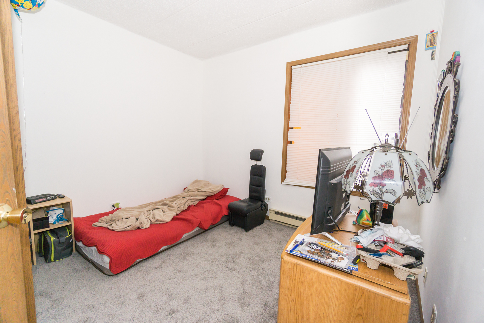 641 Briar Hill Lane, Unit 2 Addison, IL 60101 - Photo 8 of 16 a bedroom with a bed and a window