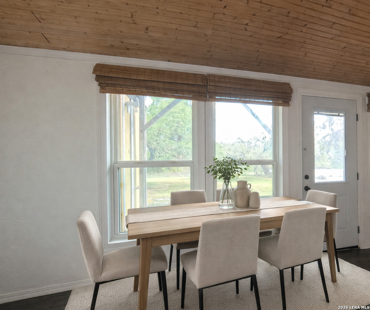 929 Red Bluff Ranch Drive Pipe Creek, TX 78063 - Photo 12 of 43 a dining room with furniture and window