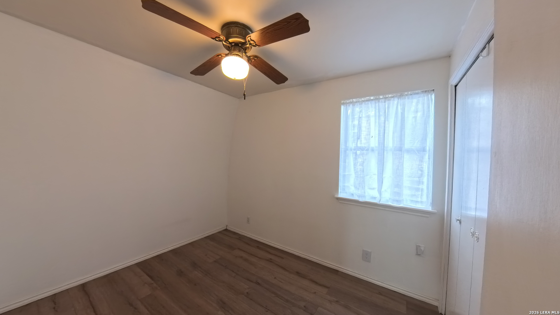 929 Red Bluff Ranch Drive Pipe Creek, TX 78063 - Photo 12 of 44 an empty room with a window and a fan