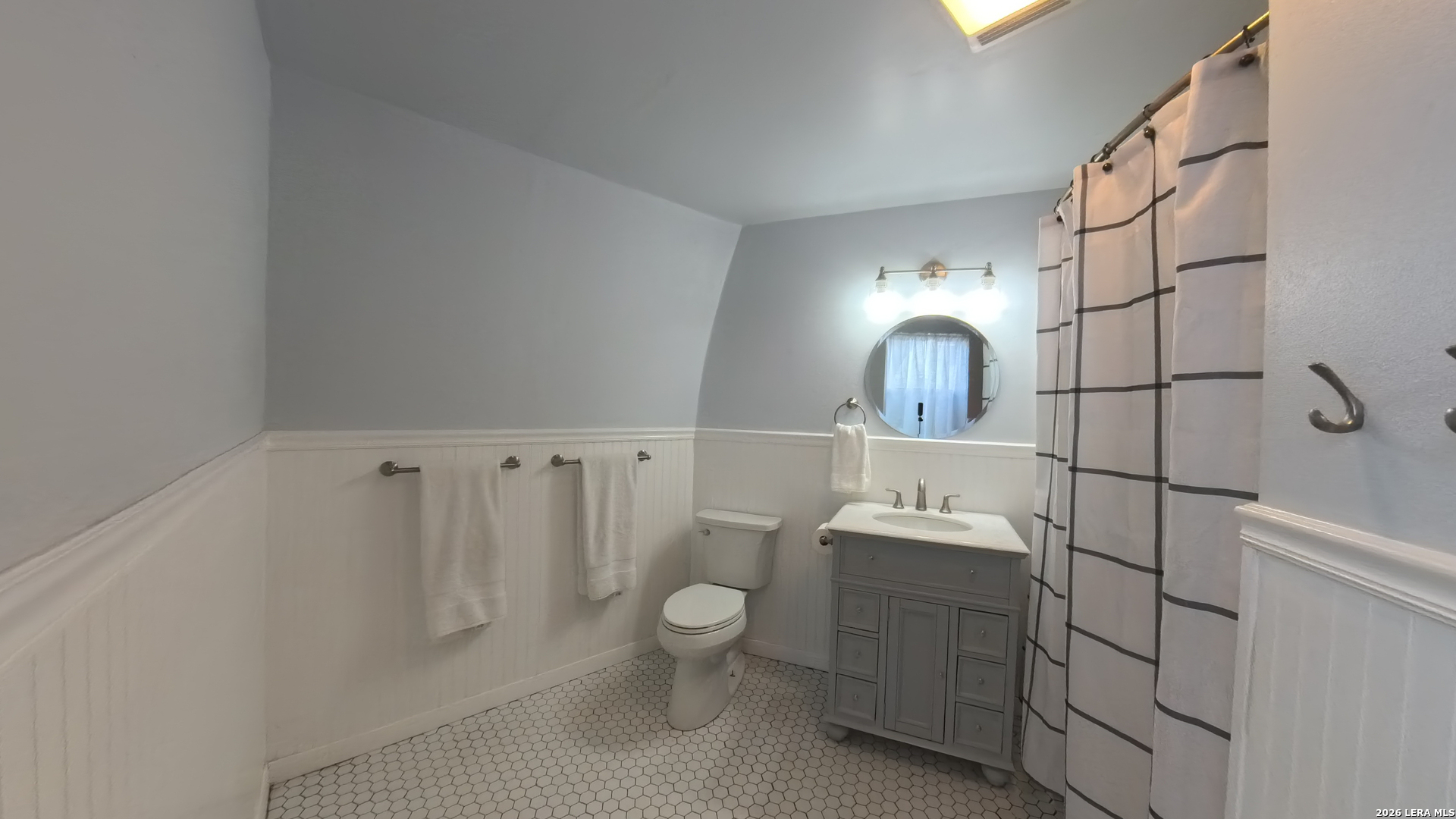 929 Red Bluff Ranch Drive Pipe Creek, TX 78063 - Photo 14 of 44 a bathroom with a toilet sink and mirror