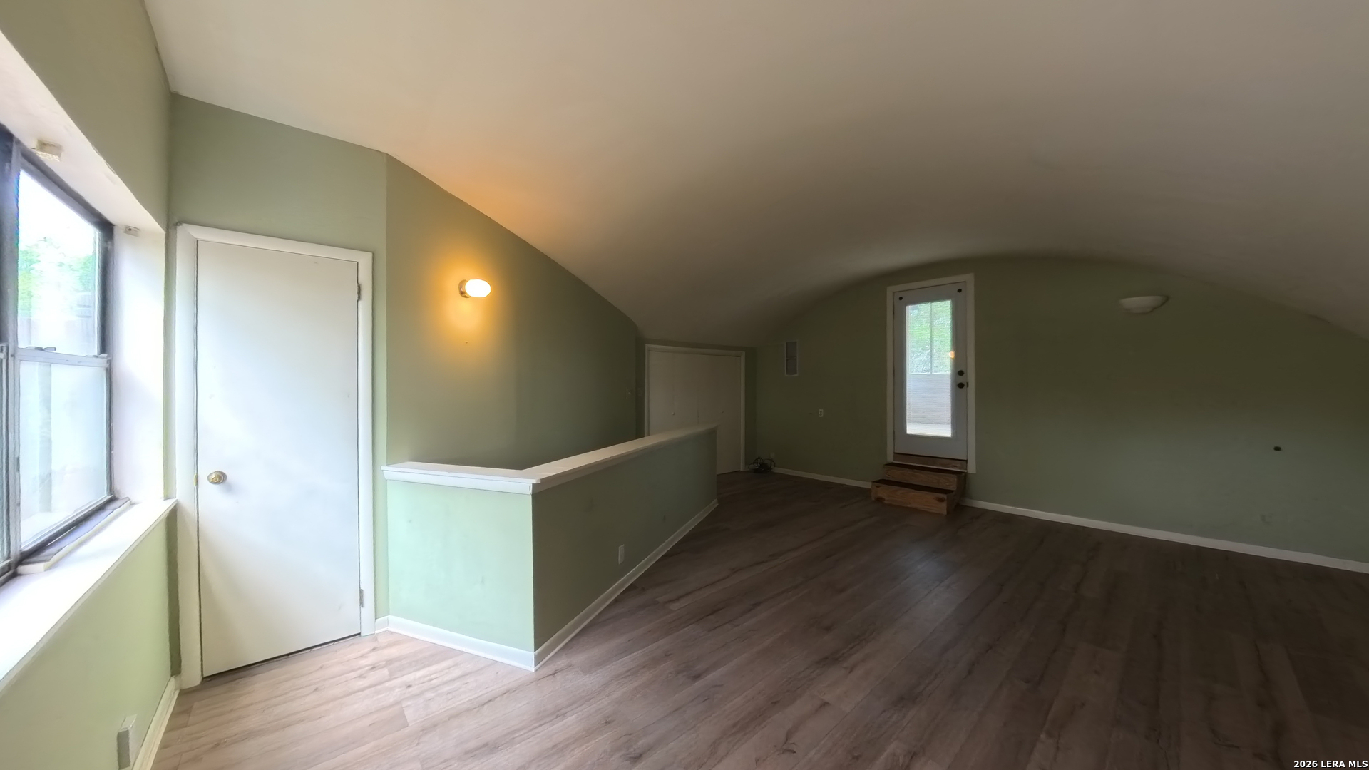929 Red Bluff Ranch Drive Pipe Creek, TX 78063 - Photo 18 of 44 a view of an empty room with wooden floor and a window