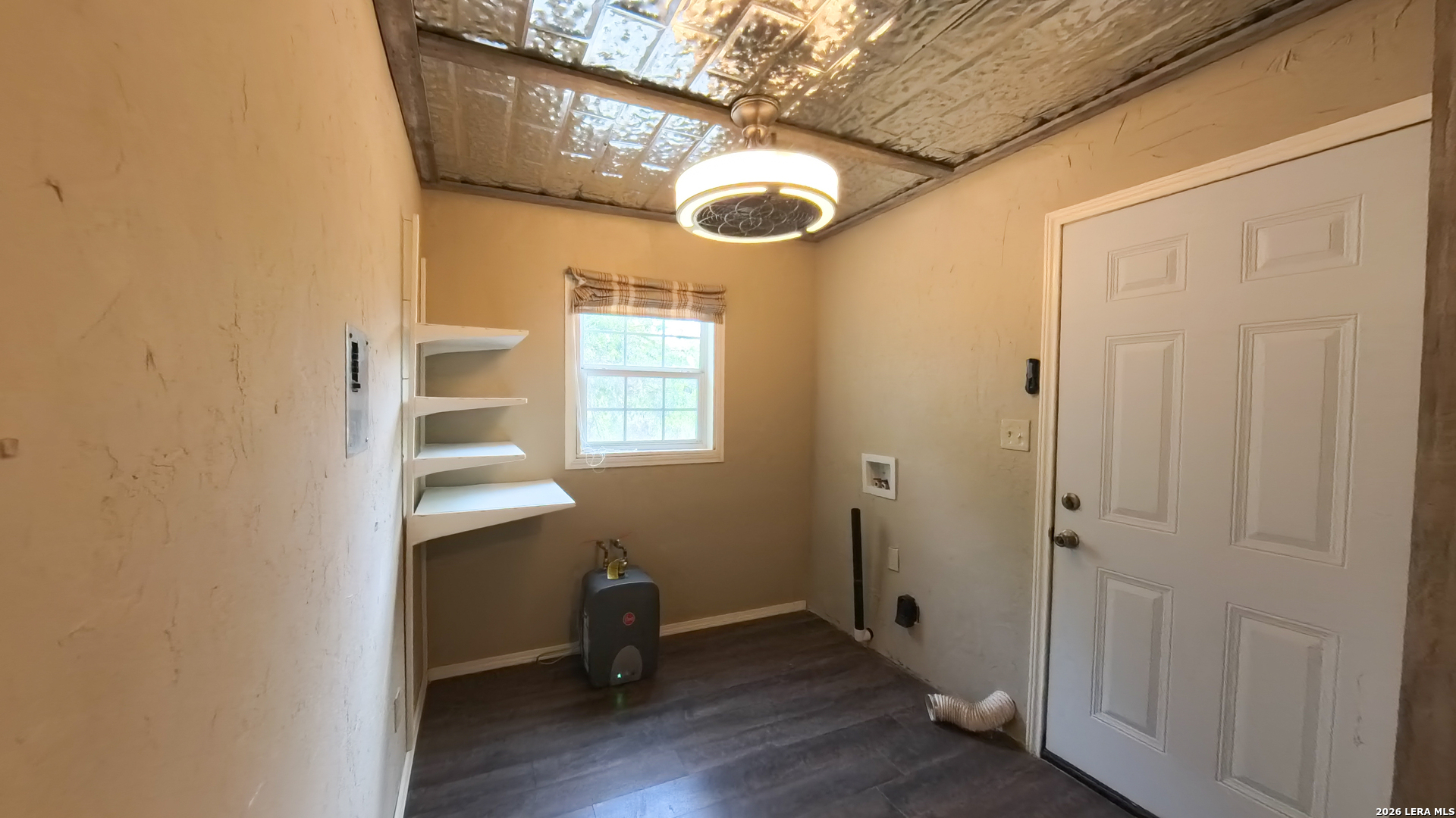929 Red Bluff Ranch Drive Pipe Creek, TX 78063 - Photo 24 of 44 a view of a room that has a window and wooden floor