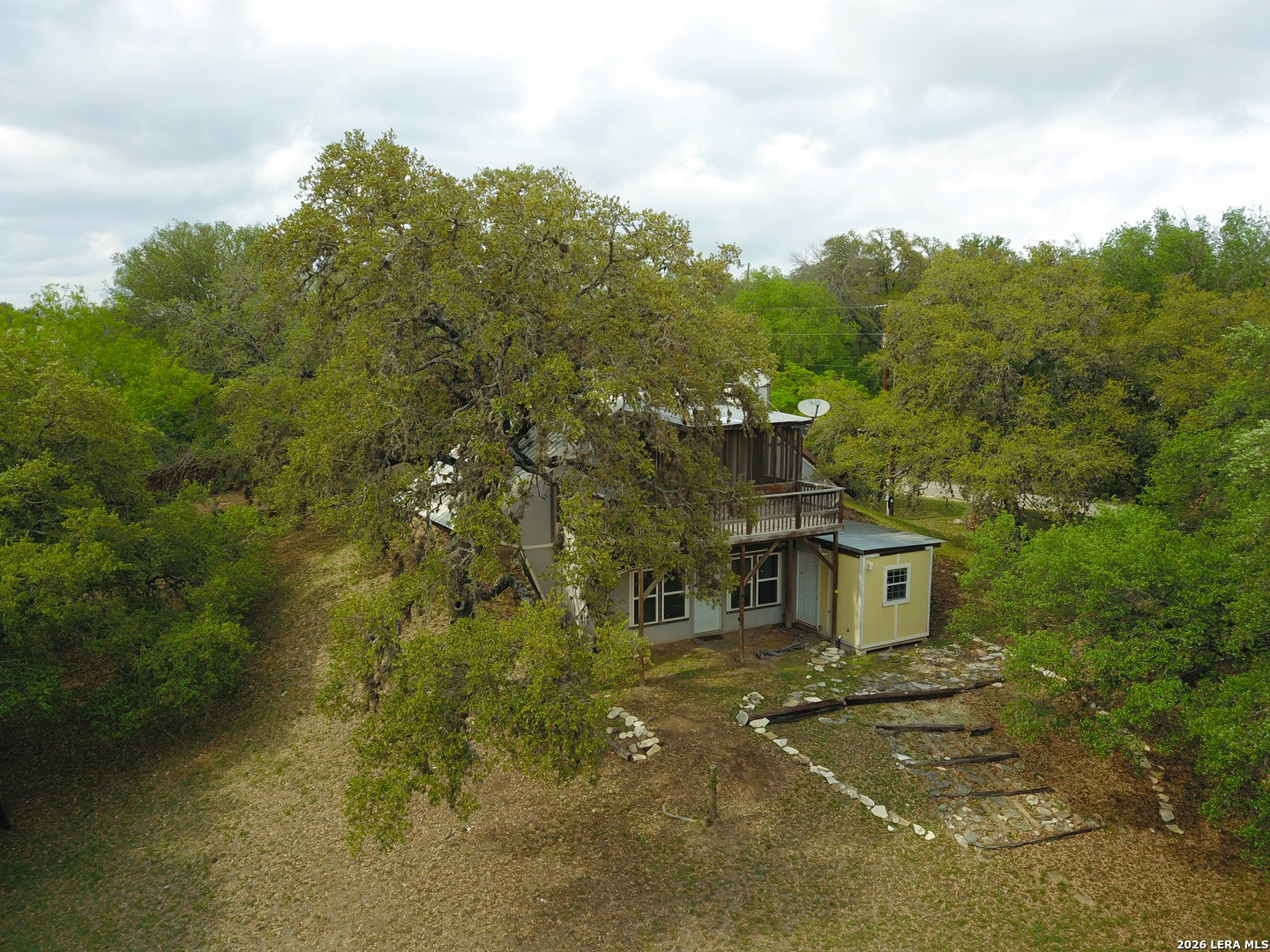 929 Red Bluff Ranch Drive Pipe Creek, TX 78063 - Photo 31 of 44 a front view of a house with a yard