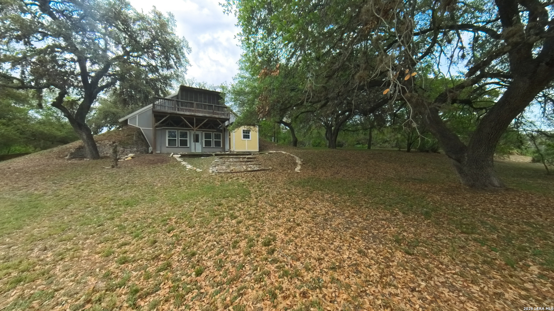 929 Red Bluff Ranch Drive Pipe Creek, TX 78063 - Photo 40 of 44 a view of a house with a yard
