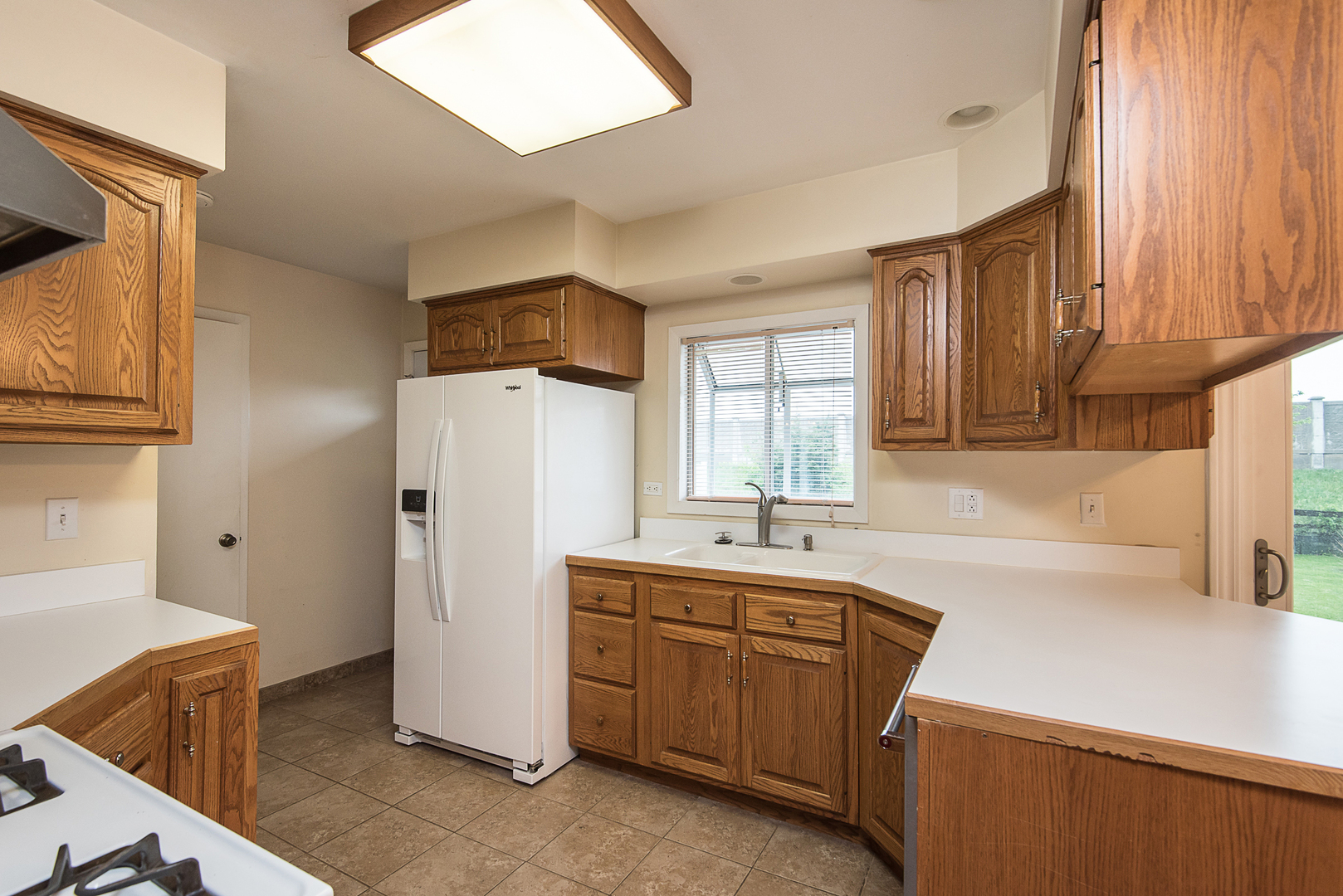 13 Wildwood Road Elk Grove Village, IL 60007 - Photo 11 of 23 a utility room with cabinets washer and dryer