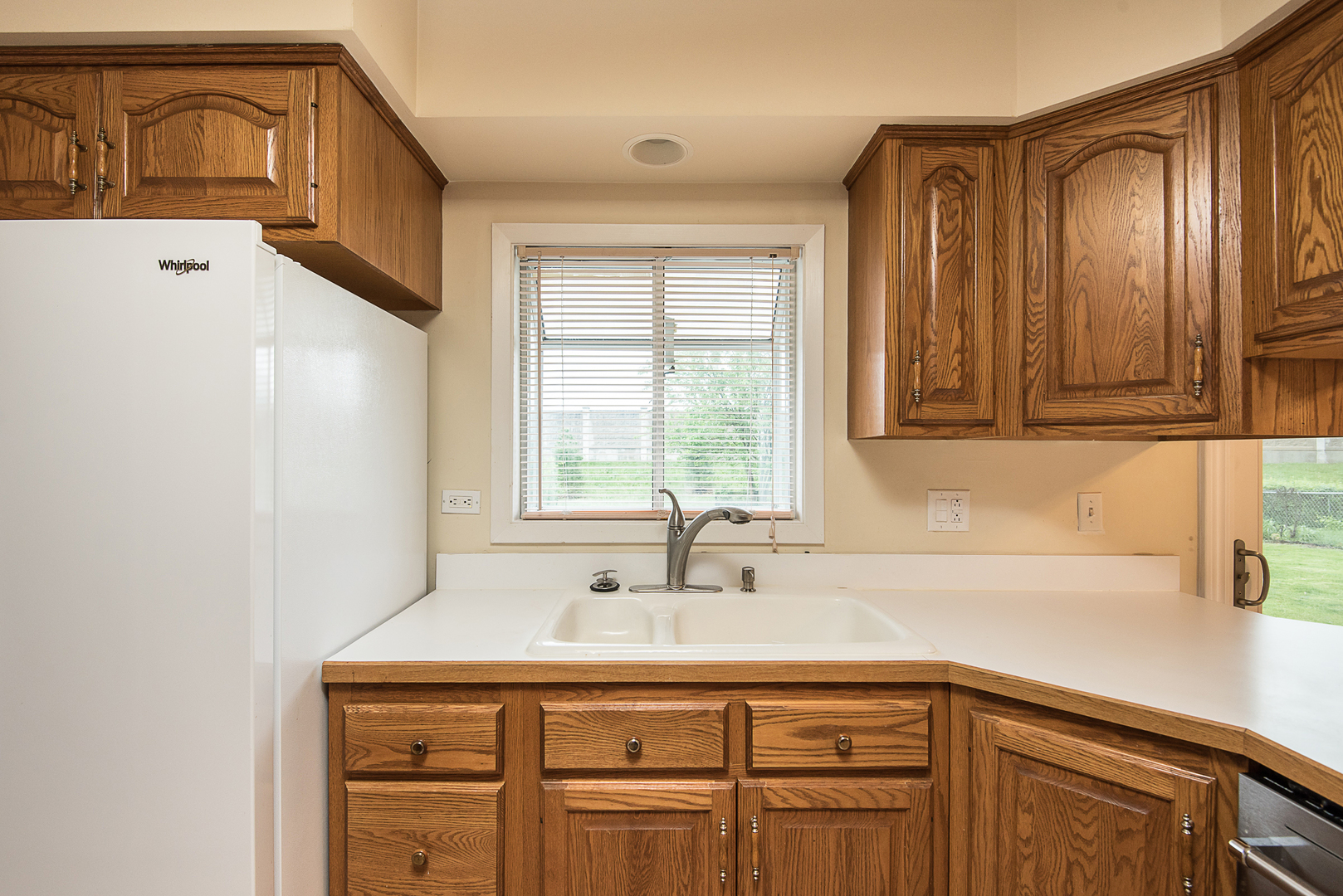 13 Wildwood Road Elk Grove Village, IL 60007 - Photo 12 of 23 a kitchen with a sink cabinets and window