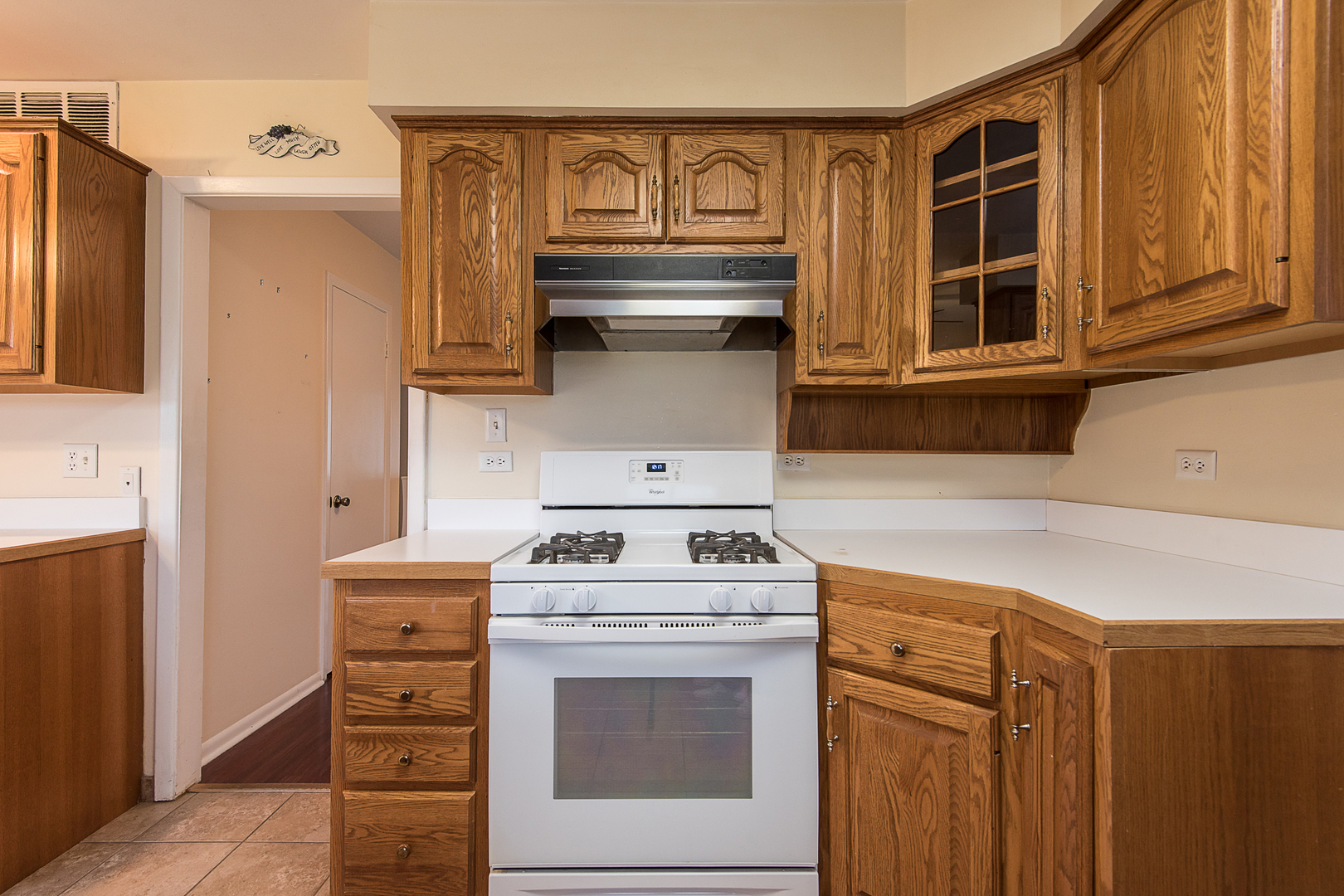13 Wildwood Road Elk Grove Village, IL 60007 - Photo 16 of 23 a kitchen with a stove and a microwave