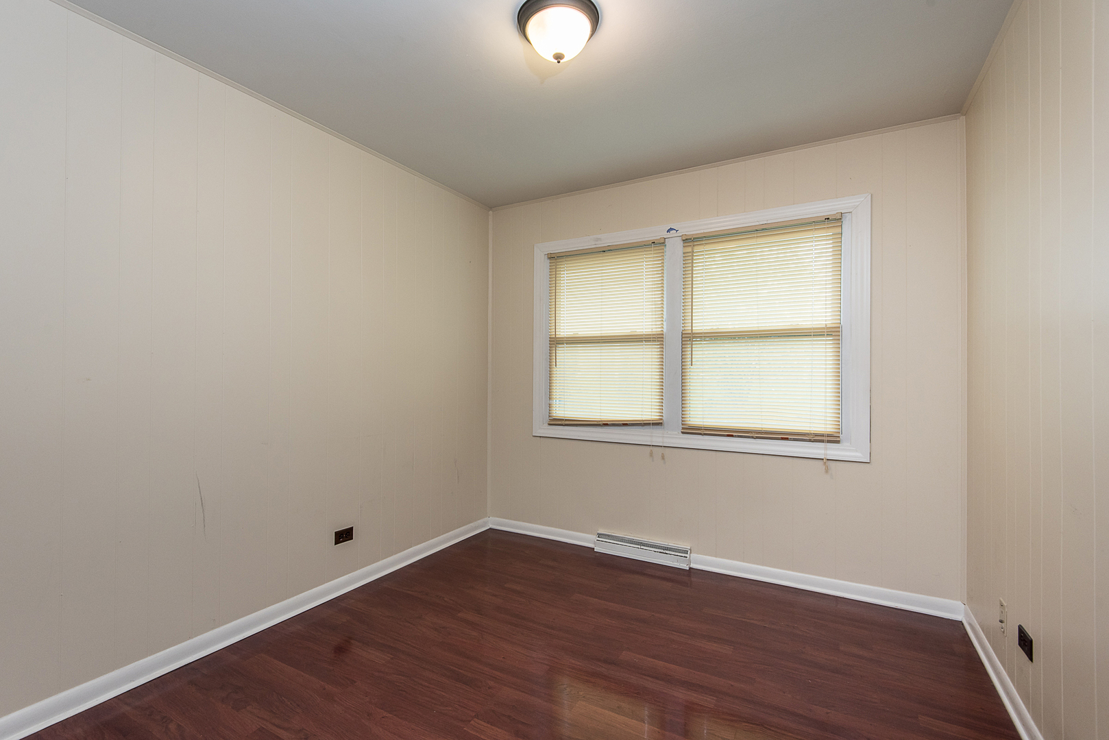 13 Wildwood Road Elk Grove Village, IL 60007 - Photo 17 of 23 an empty room with wooden floor and windows