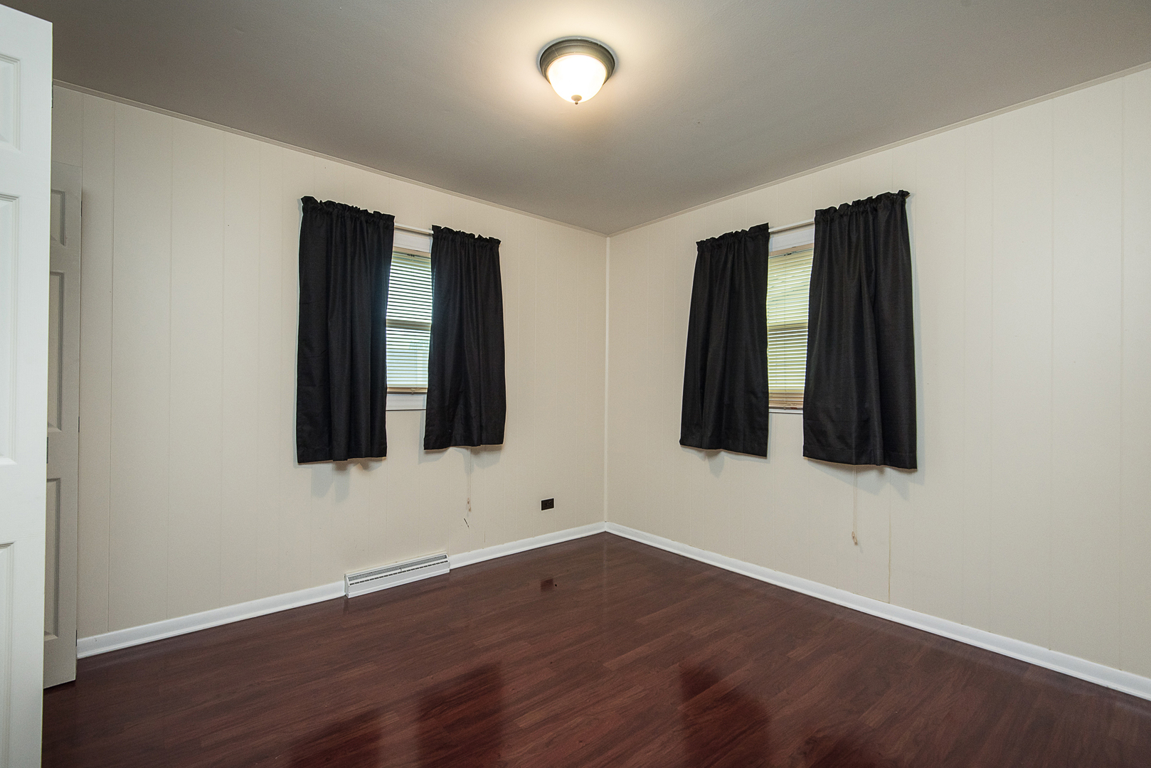 13 Wildwood Road Elk Grove Village, IL 60007 - Photo 19 of 23 an empty room with wooden floor and windows