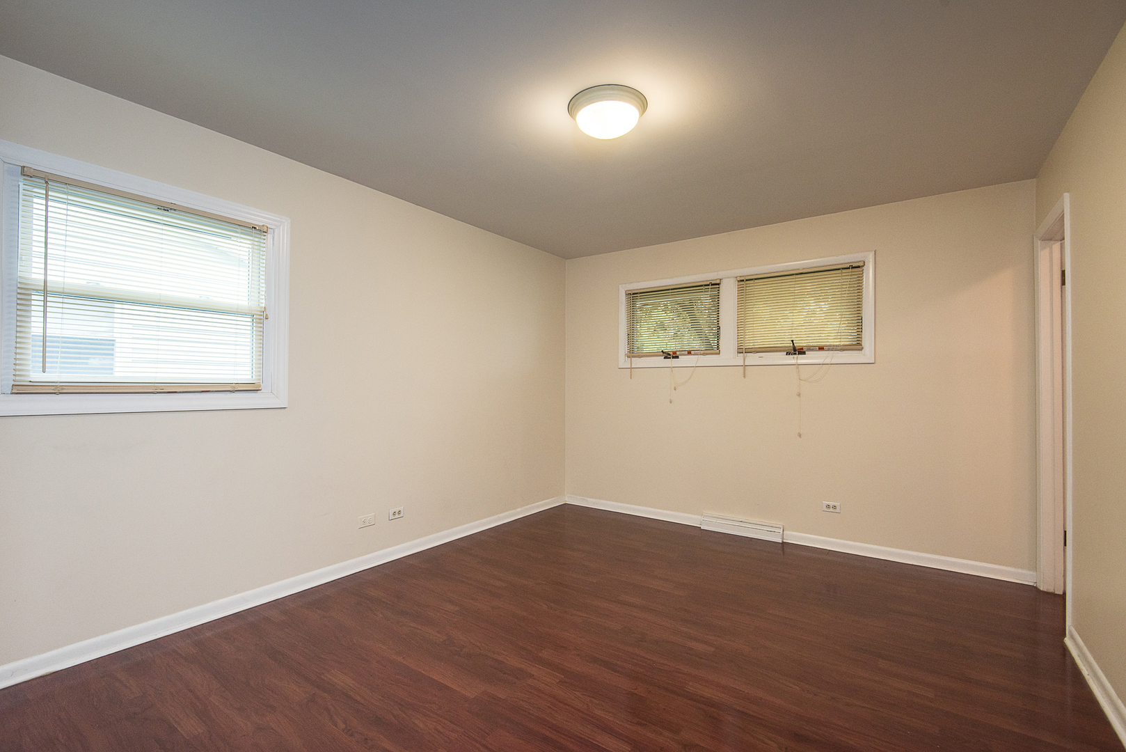 13 Wildwood Road Elk Grove Village, IL 60007 - Photo 20 of 23 a view of an empty room with wooden floor and a window