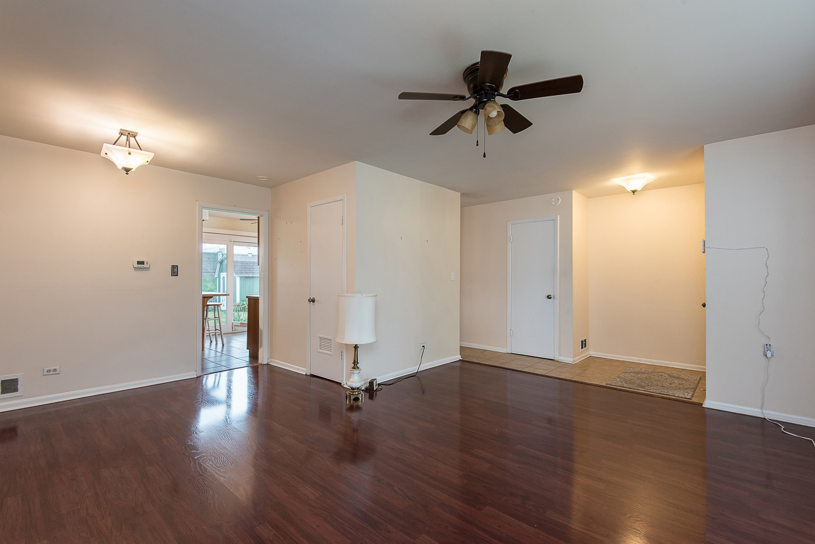 13 Wildwood Road Elk Grove Village, IL 60007 - Photo 9 of 23 a view of a room with wooden floor and ceiling fan