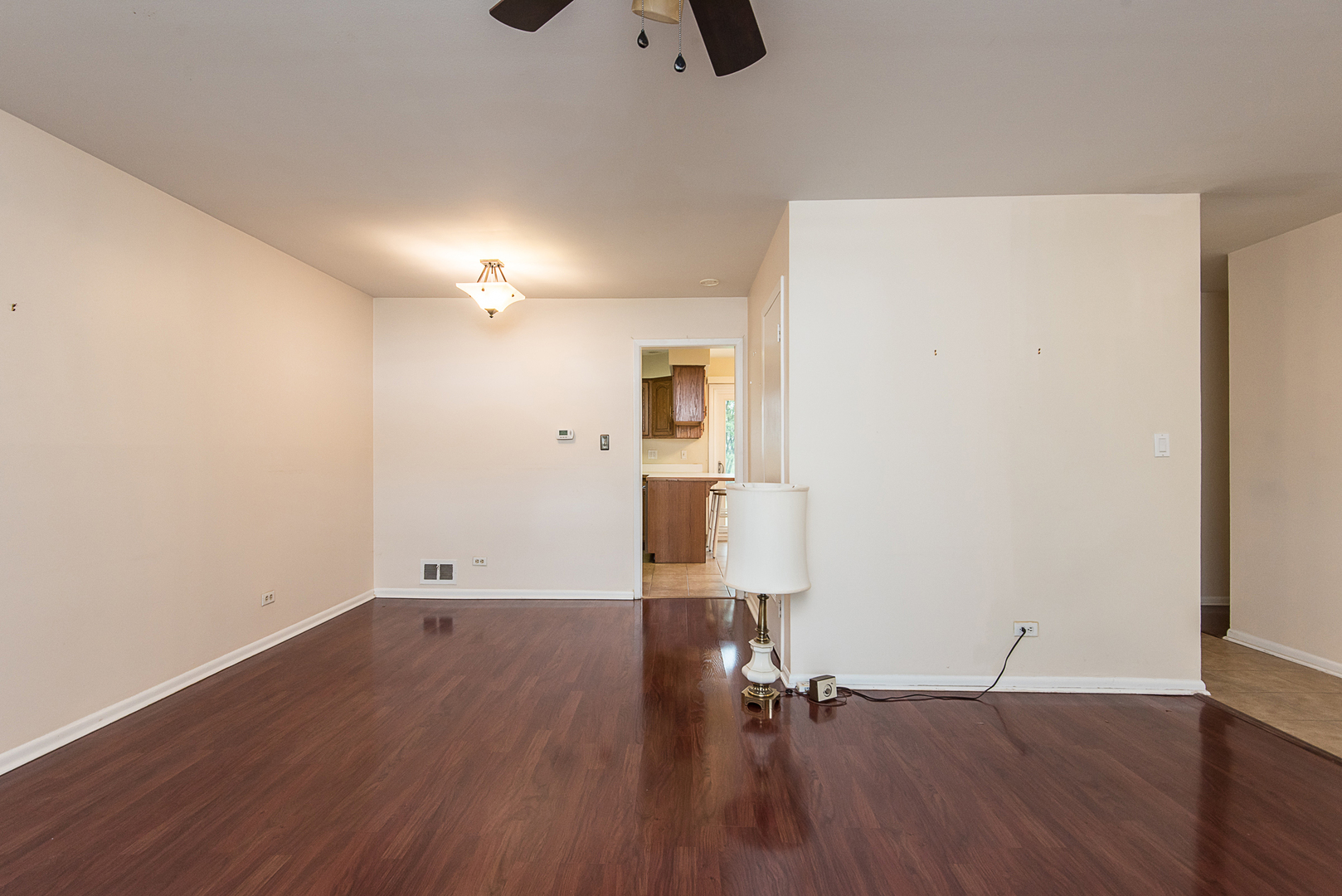 13 Wildwood Road Elk Grove Village, IL 60007 - Photo 10 of 23 an empty room with wooden floor and windows