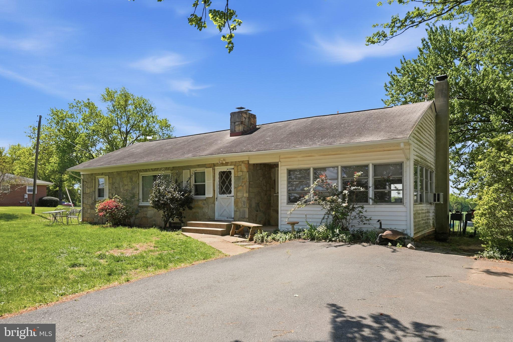 11844 Cemetery Road Remington, VA 22734 - Photo 2 of 13 Charming home with lush greenery.