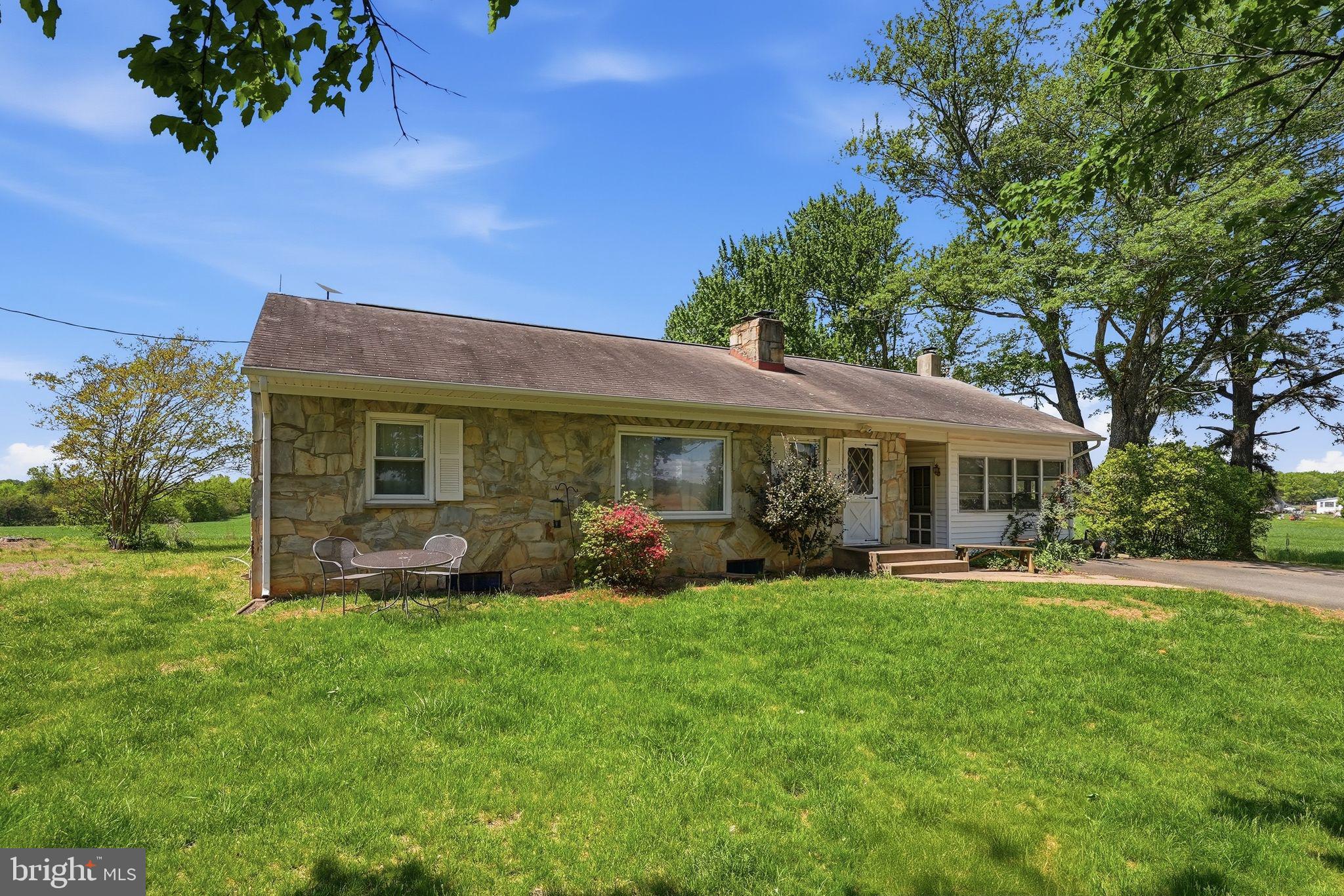 11844 Cemetery Road Remington, VA 22734 - Photo 4 of 13 Charming stone home in lush greenery.