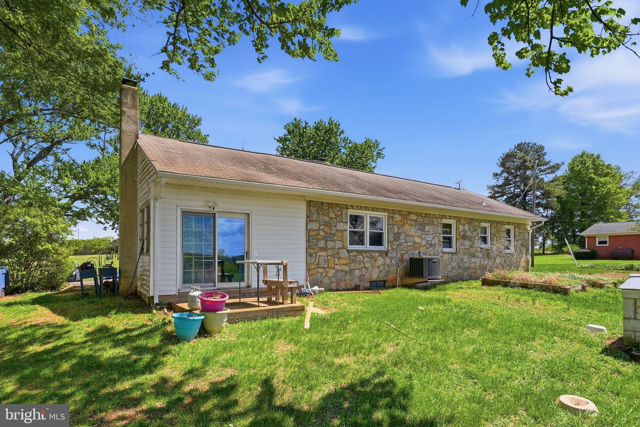 11844 Cemetery Road Remington, VA 22734 - Photo 10 of 13 Charming stone home in lush greenery.