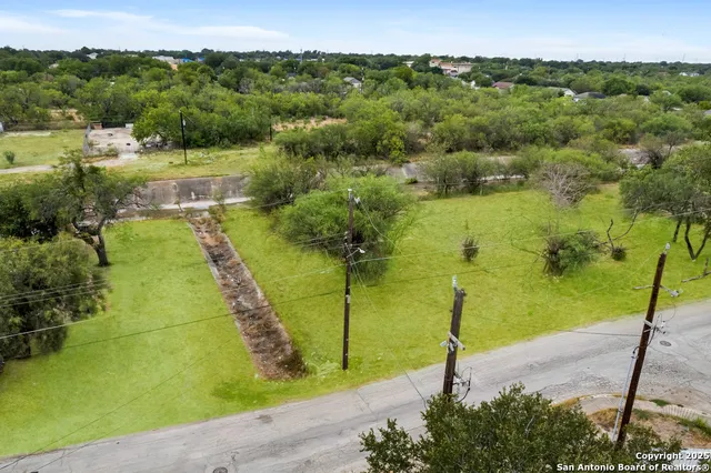 a view of a lake with a yard